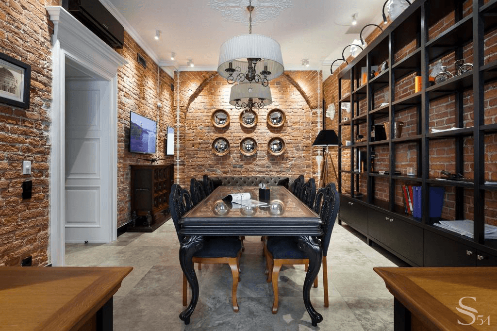 The relief of brick loft walls is emphasized by backlighting